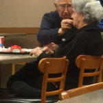 Husband feeds wife