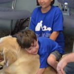 Mother Eternally Grateful As Her Child With Autism, Who Refuses All Touch, Lays Down On His New Service Dog 3