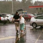 Kind Grocery Bagger Held Umbrella And Walked Elderly Woman To Her Car During Hail 1